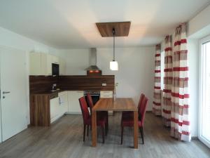 Televízia a/alebo spoločenská miestnosť v ubytovaní K3 - Appartements