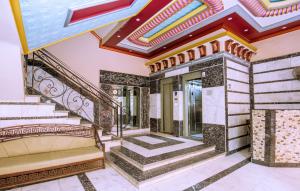 an ornate staircase in a house with a ceiling at Rare New Marina Hotspot With Fast Free WIFI, Balcony & Pool - Western Standards - Sheraton Plaza 414 in Hurghada
