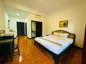 Postel nebo postele na pokoji v ubytování Angkor Tiger Resort