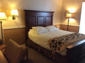Ένα ή περισσότερα κρεβάτια σε δωμάτιο στο Sage Motel
