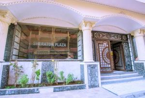 a store front of a building with a window at Rare New Marina Hotspot With Pool & Fast Free WIFI - Western Standards - Sheraton Plaza 415 in Hurghada