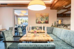 a dining room with a table and chairs at Hotel Markgraf in Lehnin