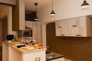 A kitchen or kitchenette at Camurria Sicilian B&B
