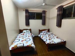 Кровать или кровати в номере UPPER PALACE Beach Road, Nyali