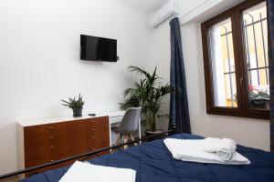 A bed or beds in a room at Camurria Sicilian B&B