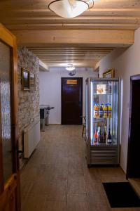 a hallway with a refrigerator in a room at Chata Myšák in Malá Morávka