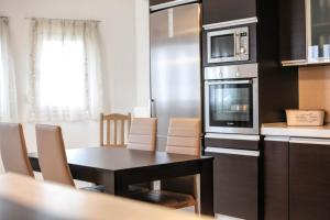 A kitchen or kitchenette at Meteora's Secret Garden House#2