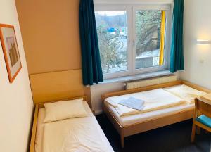 Postel nebo postele na pokoji v ubytování Akademiehotel Jena + 33 fotografií
