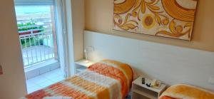 Postel nebo postele na pokoji v ubytování Hotel Ristorante Miramare