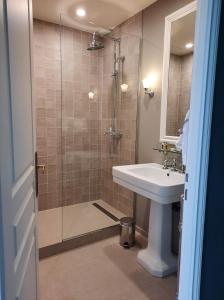 a bathroom with a shower and a sink at Chateau D'aubry in Aubry