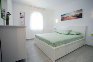 Postel nebo postele na pokoji v ubytování Vivienda Vacacional Erido
