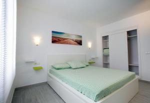 Postel nebo postele na pokoji v ubytování Vivienda Vacacional Erido + 30 fotografií