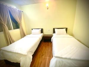 Letto o letti in una camera di Ocean Inn