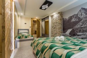 Posteľ alebo postele v izbe v ubytovaní Apartamenty Chłabówka