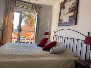 Posteľ alebo postele v izbe v ubytovaní Manilva Beach Casa de Pedro