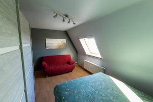 Ein Bett oder Betten in einem Zimmer der Unterkunft Huize Oesjoe
