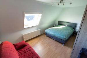 Ein Bett oder Betten in einem Zimmer der Unterkunft Huize Oesjoe