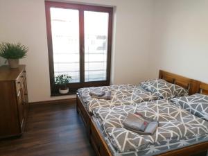 Llit o llits en una habitació de Apartmánový Dom Terchová