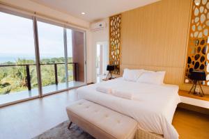 Ένα ή περισσότερα κρεβάτια σε δωμάτιο στο Melase Hill Villa +18 φωτογραφίες
