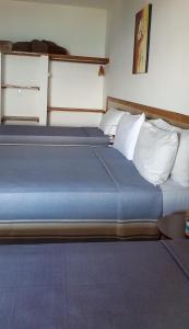 Postel nebo postele na pokoji v ubytování Pousada Três Coqueiros