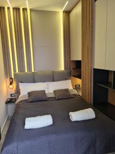 A bed or beds in a room at Stay and Spa Sarajevo Penthouse