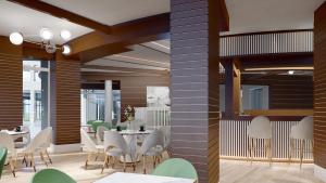 een eetkamer met een tafel en stoelen bij Effect Grand Victoria Hotel - Ultra All Inclusive in Sunny Beach