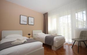 Łóżko lub łóżka w pokoju w obiekcie Apartman Nonno