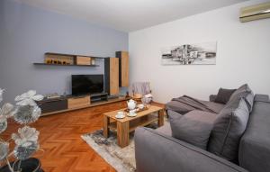 Telewizja i/lub zestaw kina domowego w obiekcie Apartman Nonno