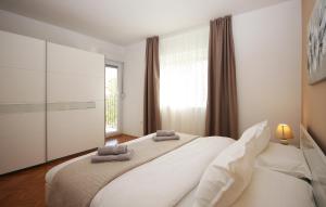 Łóżko lub łóżka w pokoju w obiekcie Apartman Nonno