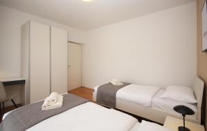Łóżko lub łóżka w pokoju w obiekcie Apartman Nonno