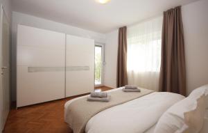 Łóżko lub łóżka w pokoju w obiekcie Apartman Nonno