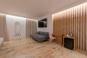 a living room with a couch and a table at Hotel Boutique Sibarys - Adults Recommended in Nerja