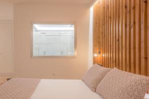 a bedroom with a bed and a window at Hotel Boutique Sibarys - Adults Recommended in Nerja