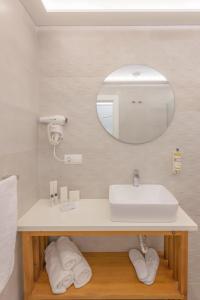 a bathroom with a sink and a mirror at Hotel Boutique Sibarys - Adults Recommended in Nerja