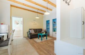 a living room with a couch and a table at Aldo Apartments Center in Zadar