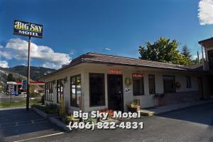 a big sky motel with a sign in front of it at Big Sky Motel in Superior