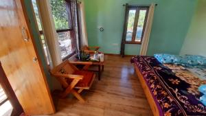 Posezení v ubytování Nanda View Cottage