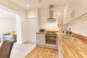 Η κουζίνα ή μικρή κουζίνα στο Barnes boutique apartment +5 φωτογραφίες
