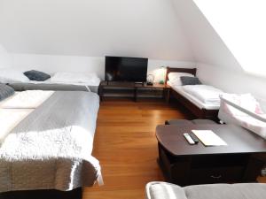Postel nebo postele na pokoji v ubytování Apartmánový Penzión Bojnice