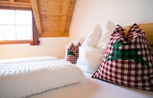 A bed or beds in a room at Gasserhof Aicha