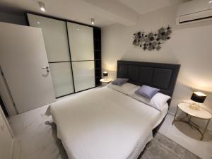 Posteľ alebo postele v izbe v ubytovaní The View Residence
