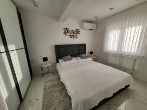 Posteľ alebo postele v izbe v ubytovaní The View Residence