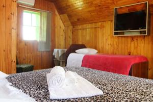 Cama ou camas em um quarto em Pousada Oliveira - Cambara do Sul-RS
