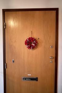 a door with a wreath on top of it at City apartment in Rovaniemi