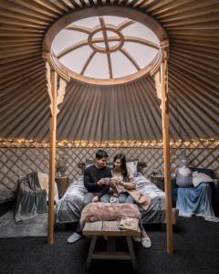Voodi või voodid majutusasutuse Yurt District toas