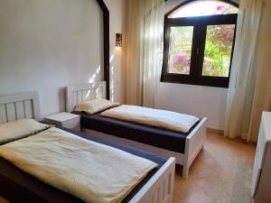 Postelja oz. postelje v sobi nastanitve Villa Melody - Holiday home in El Gouna