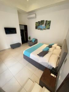 Кровать или кровати в номере Hotel Naoz