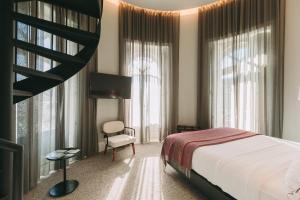 Postel nebo postele na pokoji v ubytování 1908 Lisboa Hotel