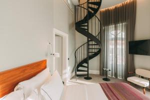 Postel nebo postele na pokoji v ubytování 1908 Lisboa Hotel