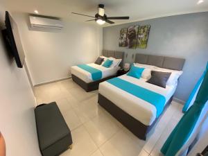 Кровать или кровати в номере Hotel Naoz